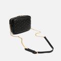 Reko bolso bandolera mini con detalles metálicos 
