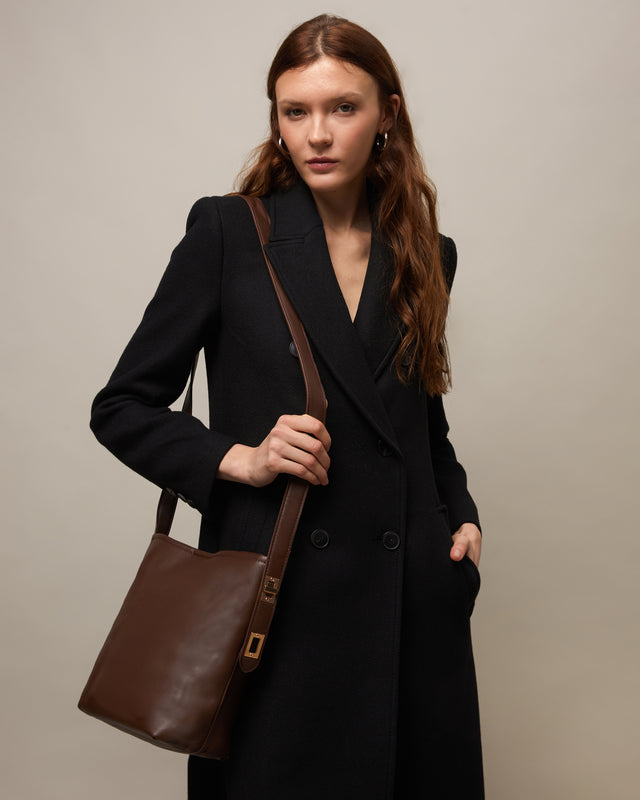 Adem mala a tiracolo com manípulo ajustável 