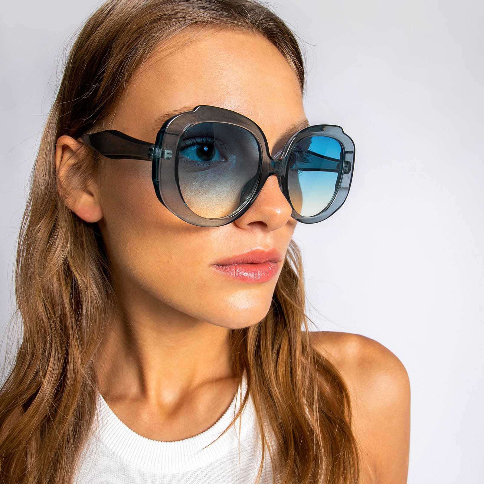 Round sunglasses with clear plastic frames 
